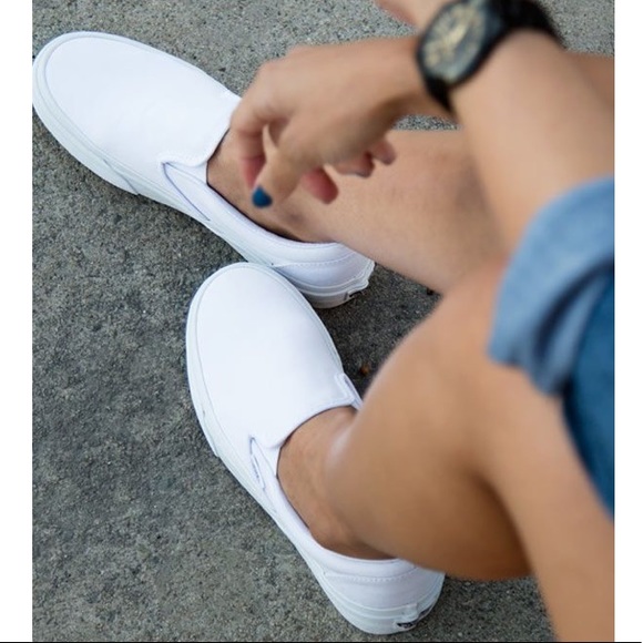 vans slip on all white on feet